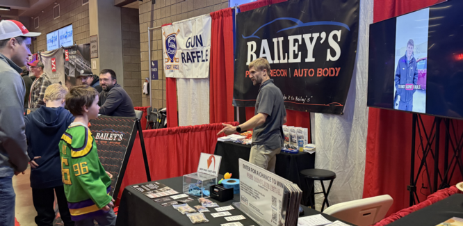 Bailey’s owner Kevin Bailey helping a winner pick out their prize